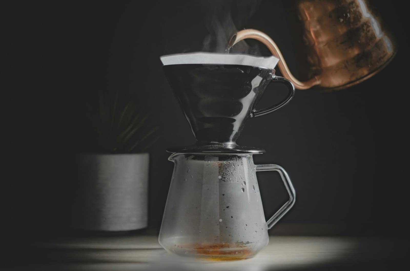 A clear glass coffee carafe filled with fresh brew