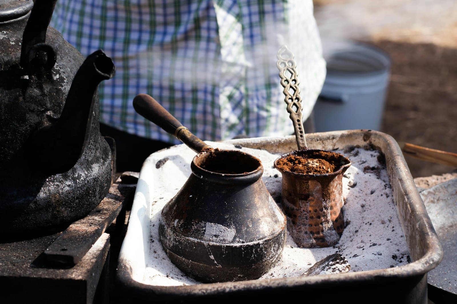 A black long-handled cezve for brewing Turkish coffee