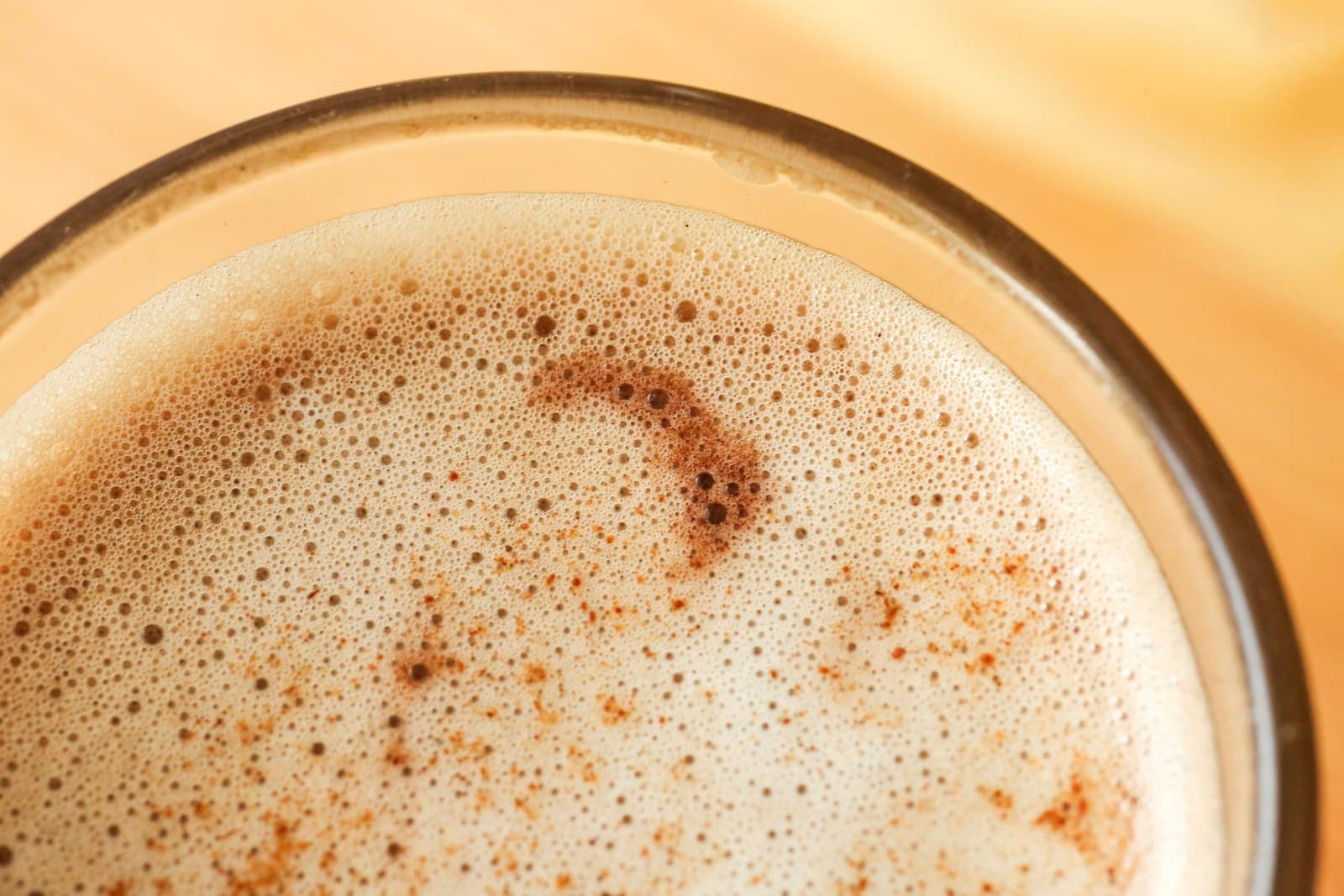 An iced coffee topped with a thick layer of cold foam